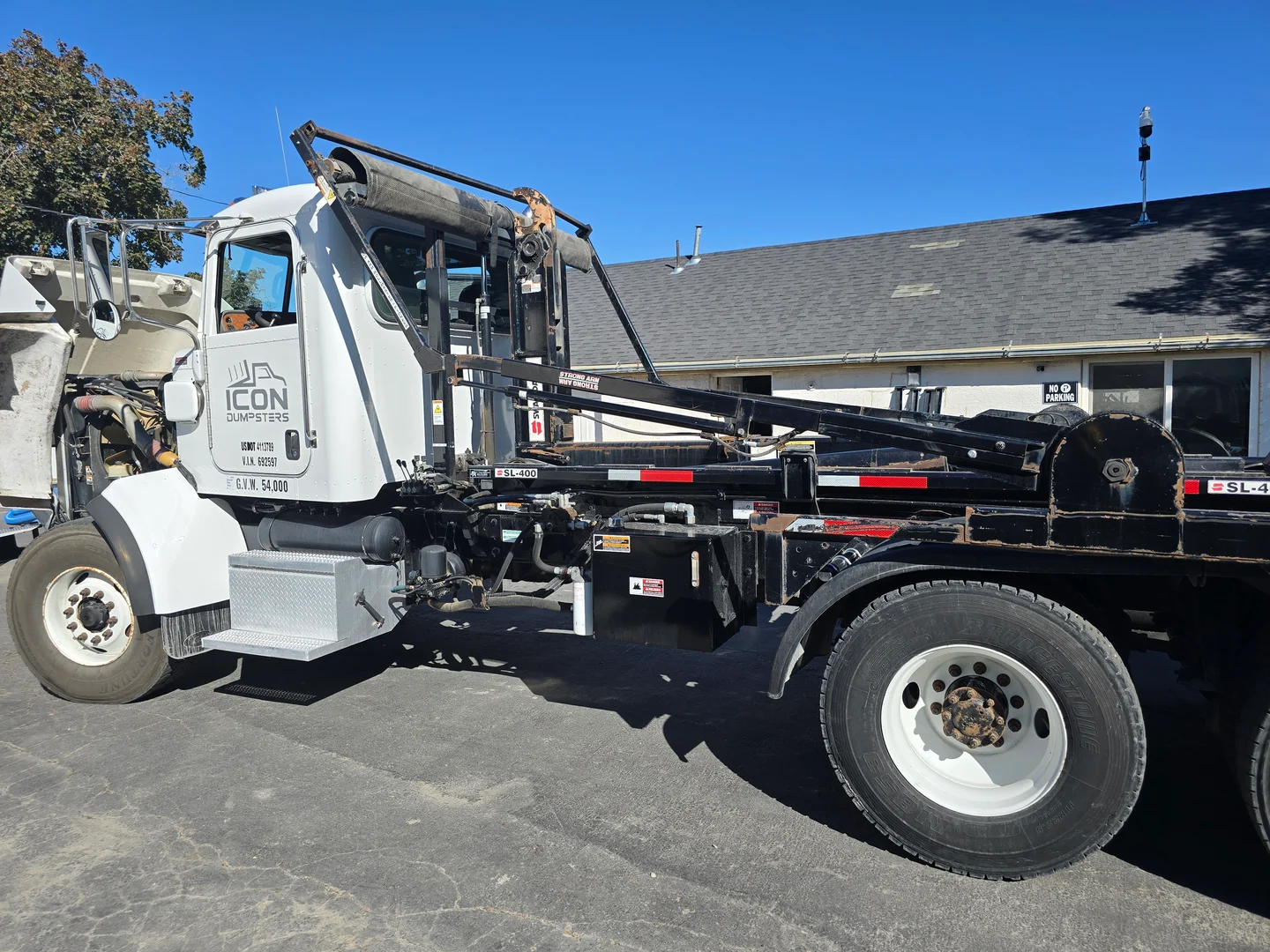 Icon Dumpsters roll-off delivery truck in Utah